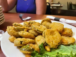 Basket of fried dill pickles appetizer at The Point Restaurant Perdido