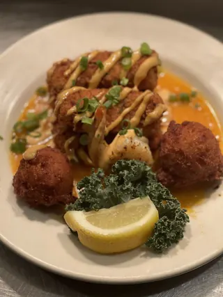 Fried crab cakes and hush puppies platter at The Point Restaurant Perdido