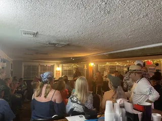 Packed dining room enjoying live music inside The Point Restaurant Perdido